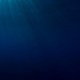 Some sun rays penetrating towards the darkness of the seabed.